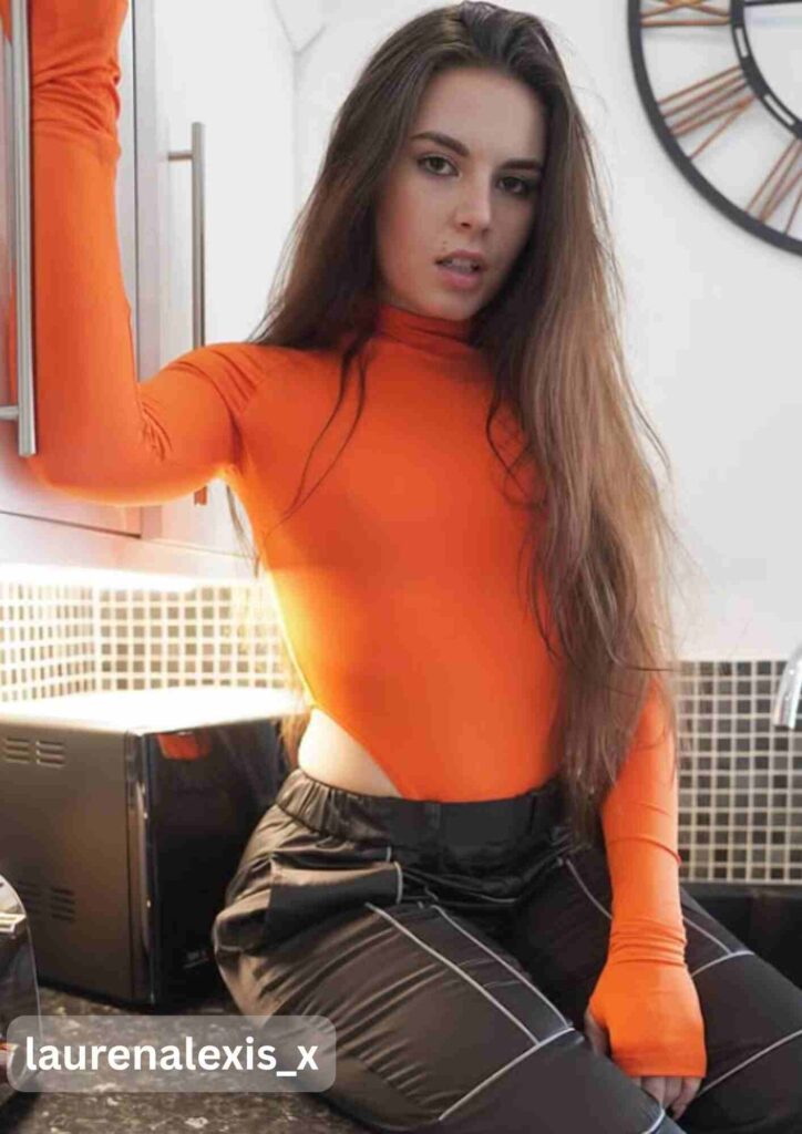 Lauren Alexis in hot orange suit with black pants.